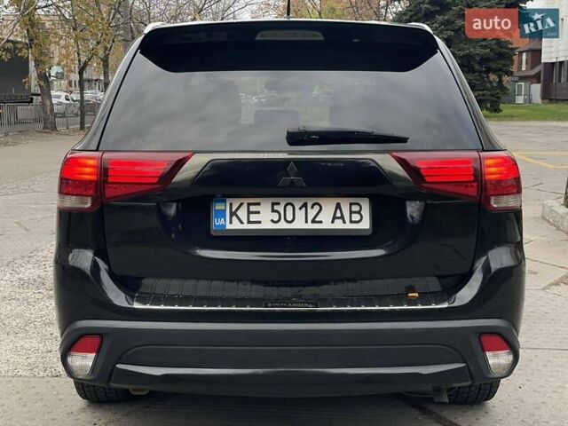 Черный Мицубиси Аутлендер, объемом двигателя 2.36 л и пробегом 167 тыс. км за 13500 $, фото 4 на Automoto.ua