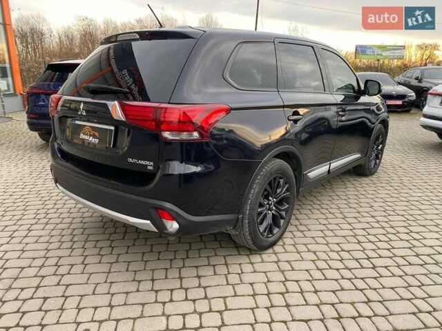 Черный Мицубиси Аутлендер, объемом двигателя 2.36 л и пробегом 143 тыс. км за 12900 $, фото 6 на Automoto.ua