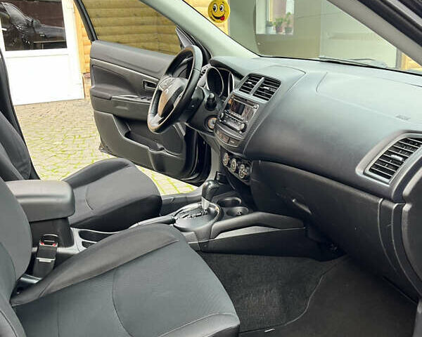 Чорний Міцубісі Аутлендер, об'ємом двигуна 2 л та пробігом 170 тис. км за 10999 $, фото 28 на Automoto.ua