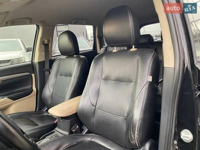 Черный Мицубиси Аутлендер, объемом двигателя 2.36 л и пробегом 143 тыс. км за 12900 $, фото 18 на Automoto.ua