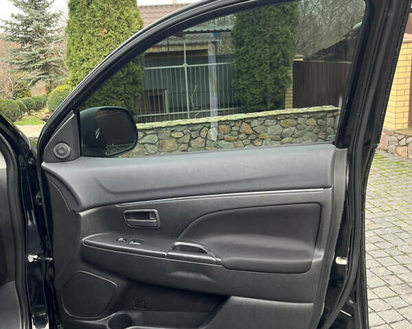 Чорний Міцубісі Аутлендер, об'ємом двигуна 2 л та пробігом 170 тис. км за 10999 $, фото 31 на Automoto.ua