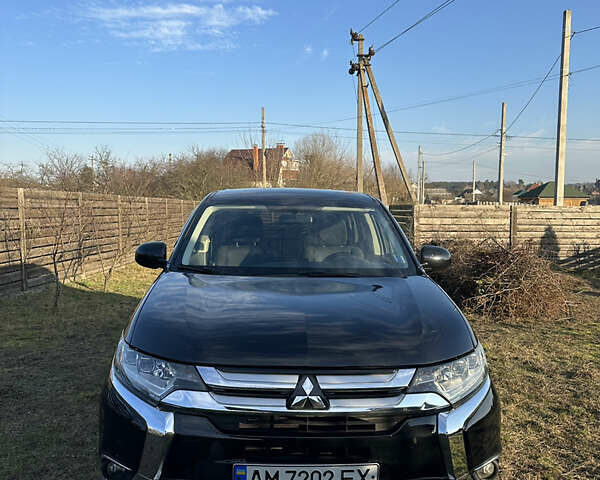 Черный Мицубиси Аутлендер, объемом двигателя 2.36 л и пробегом 144 тыс. км за 15300 $, фото 1 на Automoto.ua