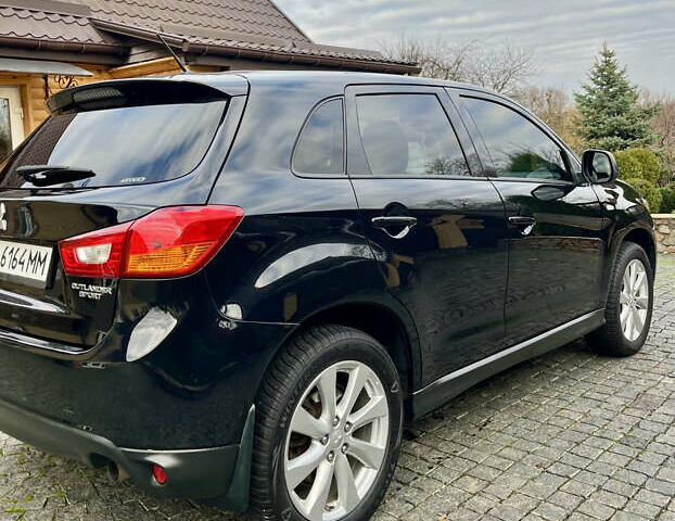 Чорний Міцубісі Аутлендер, об'ємом двигуна 2 л та пробігом 170 тис. км за 10999 $, фото 11 на Automoto.ua