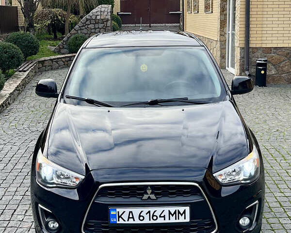 Чорний Міцубісі Аутлендер, об'ємом двигуна 2 л та пробігом 170 тис. км за 10999 $, фото 6 на Automoto.ua
