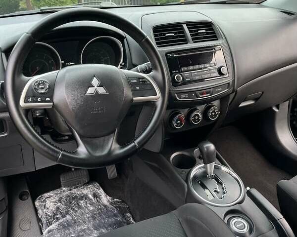 Чорний Міцубісі Аутлендер, об'ємом двигуна 2 л та пробігом 170 тис. км за 10999 $, фото 21 на Automoto.ua