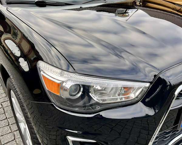 Чорний Міцубісі Аутлендер, об'ємом двигуна 2 л та пробігом 170 тис. км за 10999 $, фото 14 на Automoto.ua