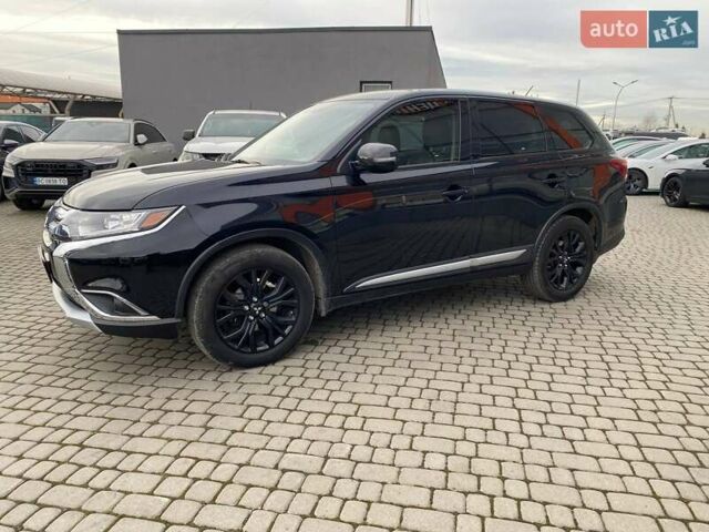 Черный Мицубиси Аутлендер, объемом двигателя 2.36 л и пробегом 143 тыс. км за 12900 $, фото 3 на Automoto.ua