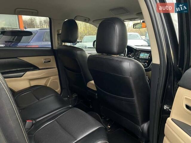 Черный Мицубиси Аутлендер, объемом двигателя 2.36 л и пробегом 143 тыс. км за 12900 $, фото 22 на Automoto.ua