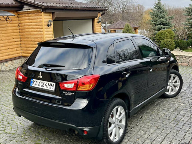 Чорний Міцубісі Аутлендер, об'ємом двигуна 2 л та пробігом 170 тис. км за 10999 $, фото 7 на Automoto.ua