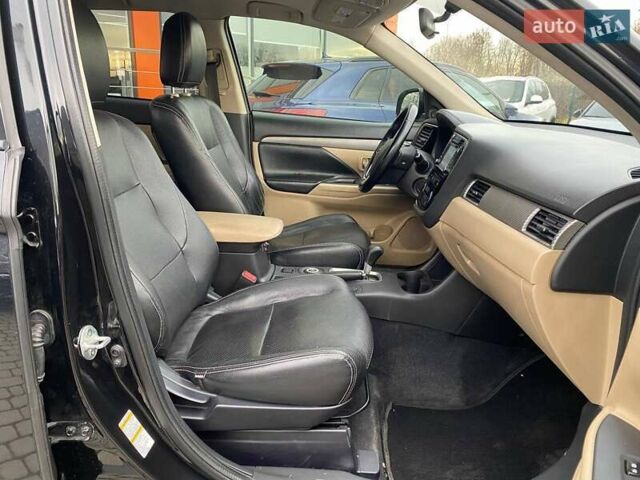 Черный Мицубиси Аутлендер, объемом двигателя 2.36 л и пробегом 143 тыс. км за 12900 $, фото 23 на Automoto.ua