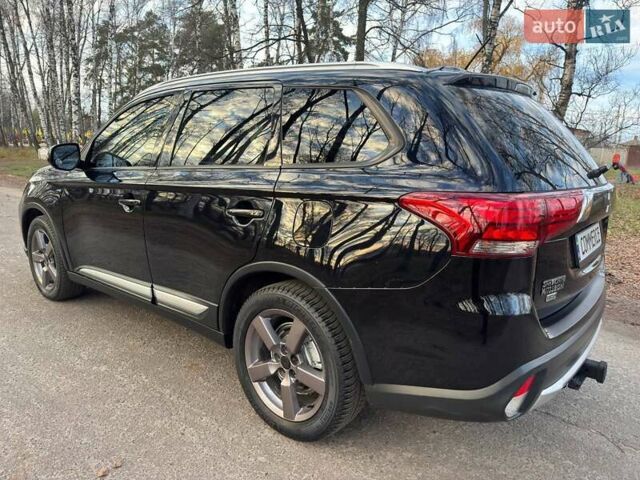 Черный Мицубиси Аутлендер, объемом двигателя 3 л и пробегом 99 тыс. км за 15800 $, фото 22 на Automoto.ua
