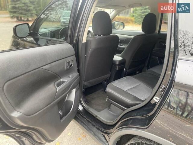 Чорний Міцубісі Аутлендер, об'ємом двигуна 2.36 л та пробігом 192 тис. км за 14200 $, фото 14 на Automoto.ua