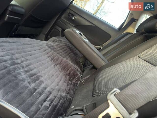 Черный Мицубиси Аутлендер, объемом двигателя 3 л и пробегом 99 тыс. км за 15800 $, фото 30 на Automoto.ua