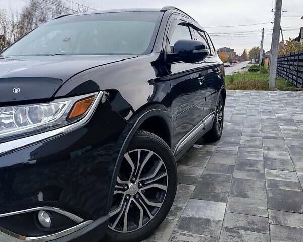 Чорний Міцубісі Аутлендер, об'ємом двигуна 2.36 л та пробігом 213 тис. км за 14500 $, фото 5 на Automoto.ua