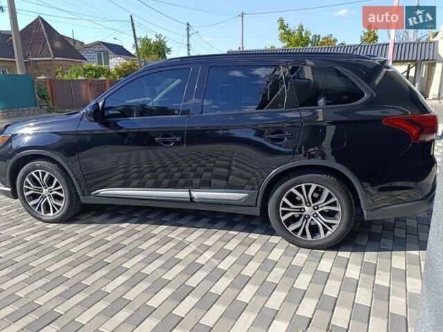 Черный Мицубиси Аутлендер, объемом двигателя 2.36 л и пробегом 120 тыс. км за 16900 $, фото 1 на Automoto.ua