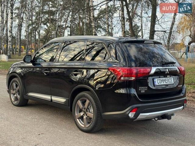 Черный Мицубиси Аутлендер, объемом двигателя 3 л и пробегом 99 тыс. км за 15800 $, фото 14 на Automoto.ua