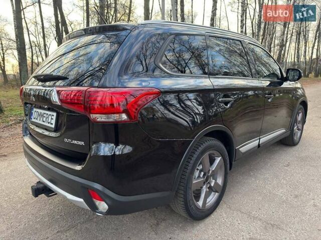 Черный Мицубиси Аутлендер, объемом двигателя 3 л и пробегом 99 тыс. км за 15800 $, фото 23 на Automoto.ua