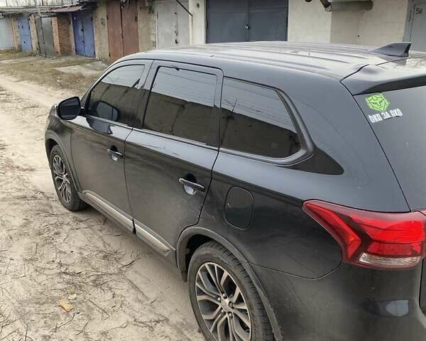 Черный Мицубиси Аутлендер, объемом двигателя 2.4 л и пробегом 185 тыс. км за 14300 $, фото 2 на Automoto.ua