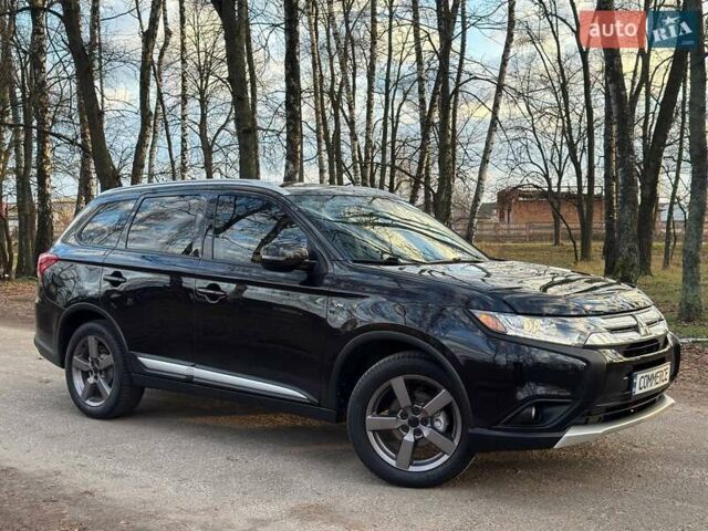 Черный Мицубиси Аутлендер, объемом двигателя 3 л и пробегом 99 тыс. км за 15800 $, фото 1 на Automoto.ua