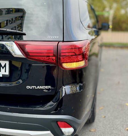 Чорний Міцубісі Аутлендер, об'ємом двигуна 2.36 л та пробігом 154 тис. км за 19500 $, фото 2 на Automoto.ua