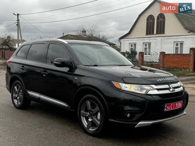Черный Мицубиси Аутлендер, объемом двигателя 3 л и пробегом 99 тыс. км за 15980 $, фото 2 на Automoto.ua