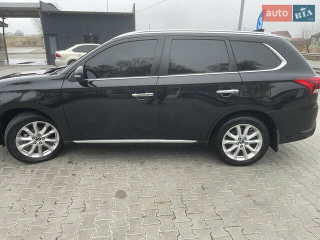 Чорний Міцубісі Аутлендер, об'ємом двигуна 2 л та пробігом 145 тис. км за 21200 $, фото 3 на Automoto.ua