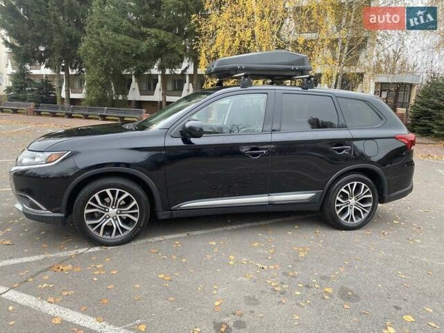 Чорний Міцубісі Аутлендер, об'ємом двигуна 2.36 л та пробігом 192 тис. км за 14200 $, фото 1 на Automoto.ua