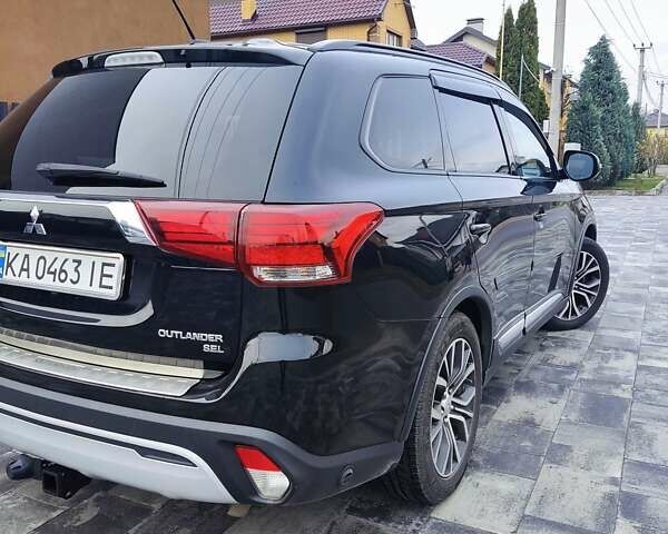 Чорний Міцубісі Аутлендер, об'ємом двигуна 2.36 л та пробігом 213 тис. км за 14500 $, фото 8 на Automoto.ua