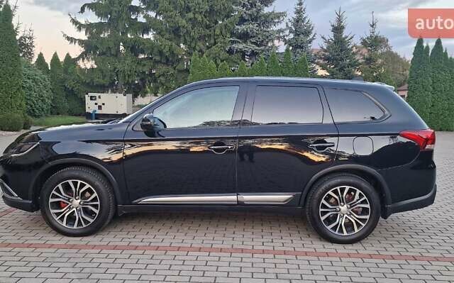 Черный Мицубиси Аутлендер, объемом двигателя 2.36 л и пробегом 168 тыс. км за 14999 $, фото 6 на Automoto.ua