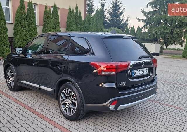 Черный Мицубиси Аутлендер, объемом двигателя 2.36 л и пробегом 168 тыс. км за 14999 $, фото 1 на Automoto.ua