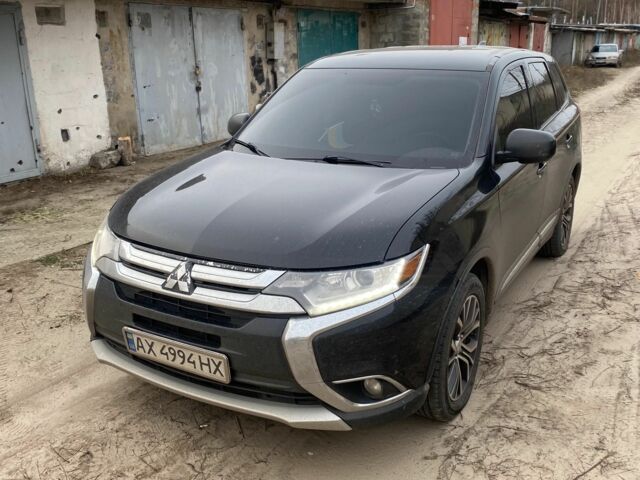 Черный Мицубиси Аутлендер, объемом двигателя 2.4 л и пробегом 185 тыс. км за 14300 $, фото 1 на Automoto.ua