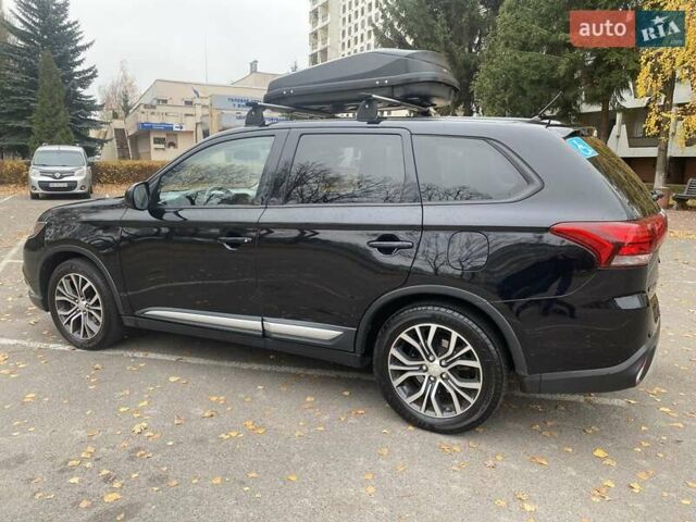 Чорний Міцубісі Аутлендер, об'ємом двигуна 2.36 л та пробігом 192 тис. км за 14200 $, фото 2 на Automoto.ua