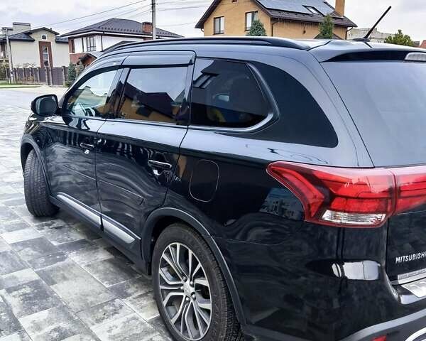 Чорний Міцубісі Аутлендер, об'ємом двигуна 2.36 л та пробігом 213 тис. км за 14500 $, фото 6 на Automoto.ua