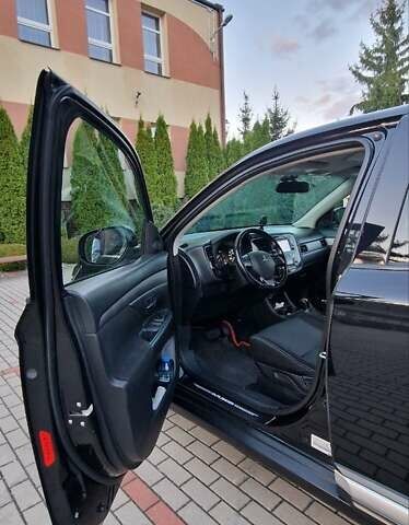 Черный Мицубиси Аутлендер, объемом двигателя 2.36 л и пробегом 168 тыс. км за 14999 $, фото 2 на Automoto.ua