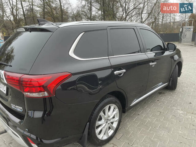Чорний Міцубісі Аутлендер, об'ємом двигуна 2 л та пробігом 145 тис. км за 21200 $, фото 14 на Automoto.ua