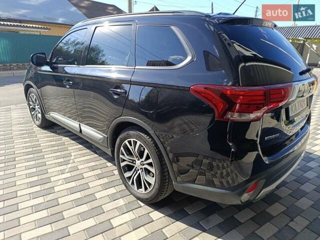 Черный Мицубиси Аутлендер, объемом двигателя 2.36 л и пробегом 120 тыс. км за 16900 $, фото 3 на Automoto.ua