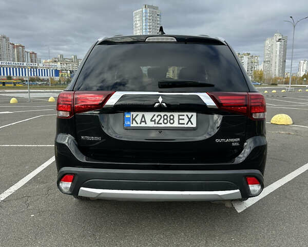 Чорний Міцубісі Аутлендер, об'ємом двигуна 2.36 л та пробігом 166 тис. км за 17100 $, фото 23 на Automoto.ua