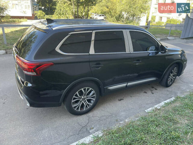 Чорний Міцубісі Аутлендер, об'ємом двигуна 2.36 л та пробігом 150 тис. км за 13500 $, фото 4 на Automoto.ua