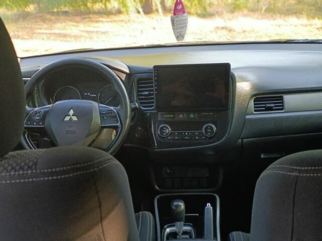 Черный Мицубиси Аутлендер, объемом двигателя 2.4 л и пробегом 156 тыс. км за 330 $, фото 17 на Automoto.ua