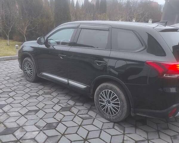 Чорний Міцубісі Аутлендер, об'ємом двигуна 2 л та пробігом 63 тис. км за 17500 $, фото 1 на Automoto.ua