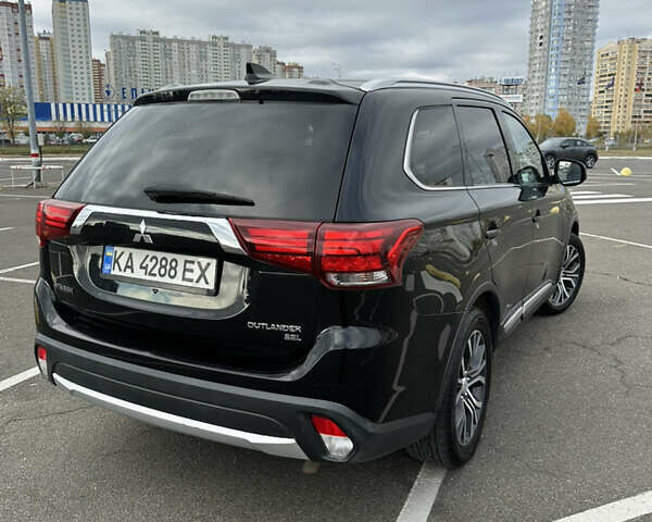 Чорний Міцубісі Аутлендер, об'ємом двигуна 2.36 л та пробігом 166 тис. км за 17100 $, фото 3 на Automoto.ua