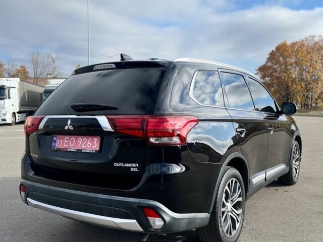 Черный Мицубиси Аутлендер, объемом двигателя 2.4 л и пробегом 91 тыс. км за 15500 $, фото 3 на Automoto.ua