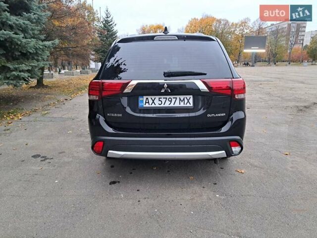 Черный Мицубиси Аутлендер, объемом двигателя 2 л и пробегом 260 тыс. км за 13700 $, фото 6 на Automoto.ua