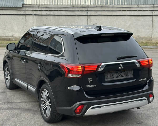 Черный Мицубиси Аутлендер, объемом двигателя 2.36 л и пробегом 128 тыс. км за 15500 $, фото 9 на Automoto.ua