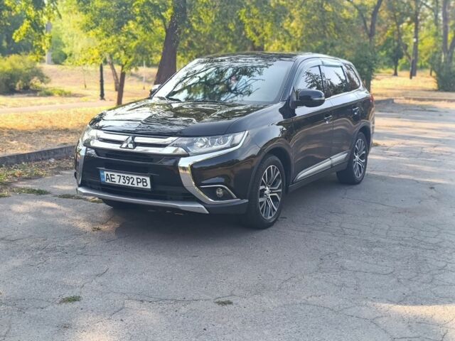 Черный Мицубиси Аутлендер, объемом двигателя 2.4 л и пробегом 156 тыс. км за 330 $, фото 1 на Automoto.ua