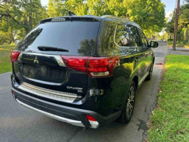 Черный Мицубиси Аутлендер, объемом двигателя 2.4 л и пробегом 66 тыс. км за 10650 $, фото 6 на Automoto.ua