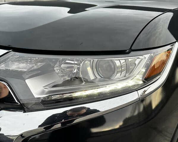 Черный Мицубиси Аутлендер, объемом двигателя 2.36 л и пробегом 128 тыс. км за 15500 $, фото 2 на Automoto.ua