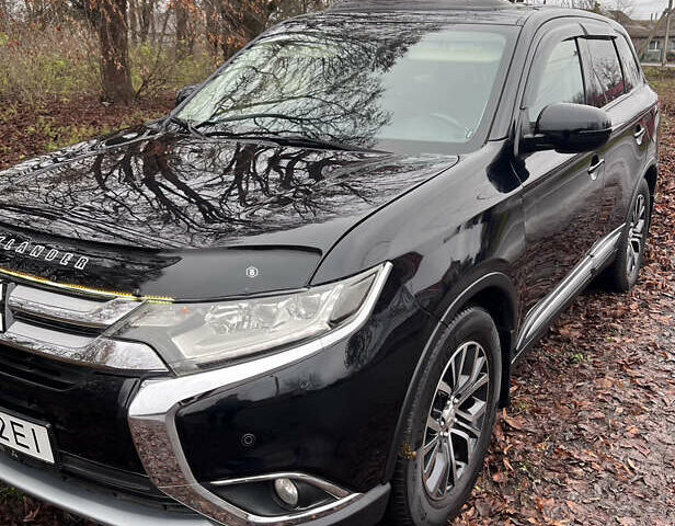 Чорний Міцубісі Аутлендер, об'ємом двигуна 2.36 л та пробігом 110 тис. км за 17500 $, фото 6 на Automoto.ua