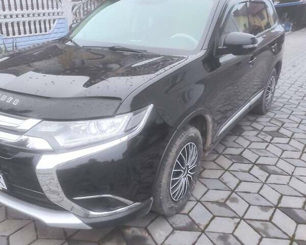 Чорний Міцубісі Аутлендер, об'ємом двигуна 2 л та пробігом 63 тис. км за 17500 $, фото 6 на Automoto.ua