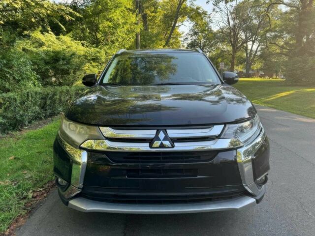 Черный Мицубиси Аутлендер, объемом двигателя 2.4 л и пробегом 66 тыс. км за 10650 $, фото 1 на Automoto.ua